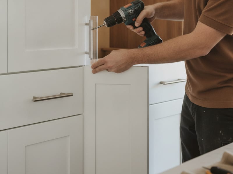 Brushed nickel bar pulls installed on new shaker cabinet doors in a San Diego County kitchen